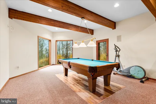 a view of an empty room with windows