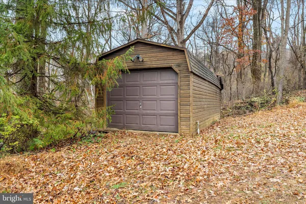 an aerial view of a house with yard swimming pool and outdoor seating