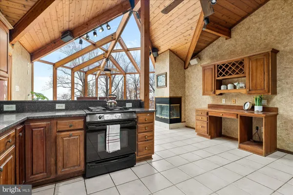 a kitchen with stainless steel appliances granite countertop a stove and a sink