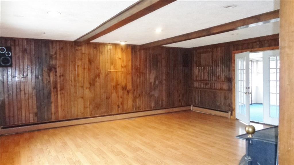 5545 Glass Road Pittsburgh, PA 15205 - Photo 6 of 18 FAMILY ROOM. Huge 20' x 20' room. Hard Wood Floor. French Door to Back Porch. Beamed Ceiling.