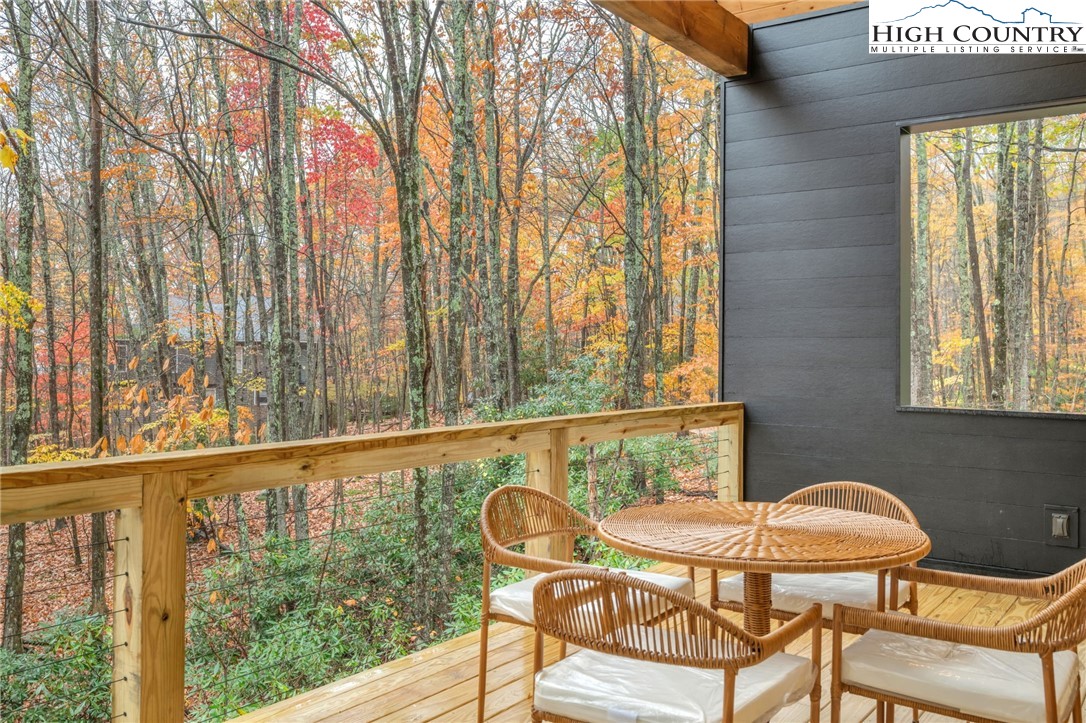 106 Jackpine Road Beech Mountain, NC 28604 - Photo 20 of 30 a balcony view with a outdoor seating space