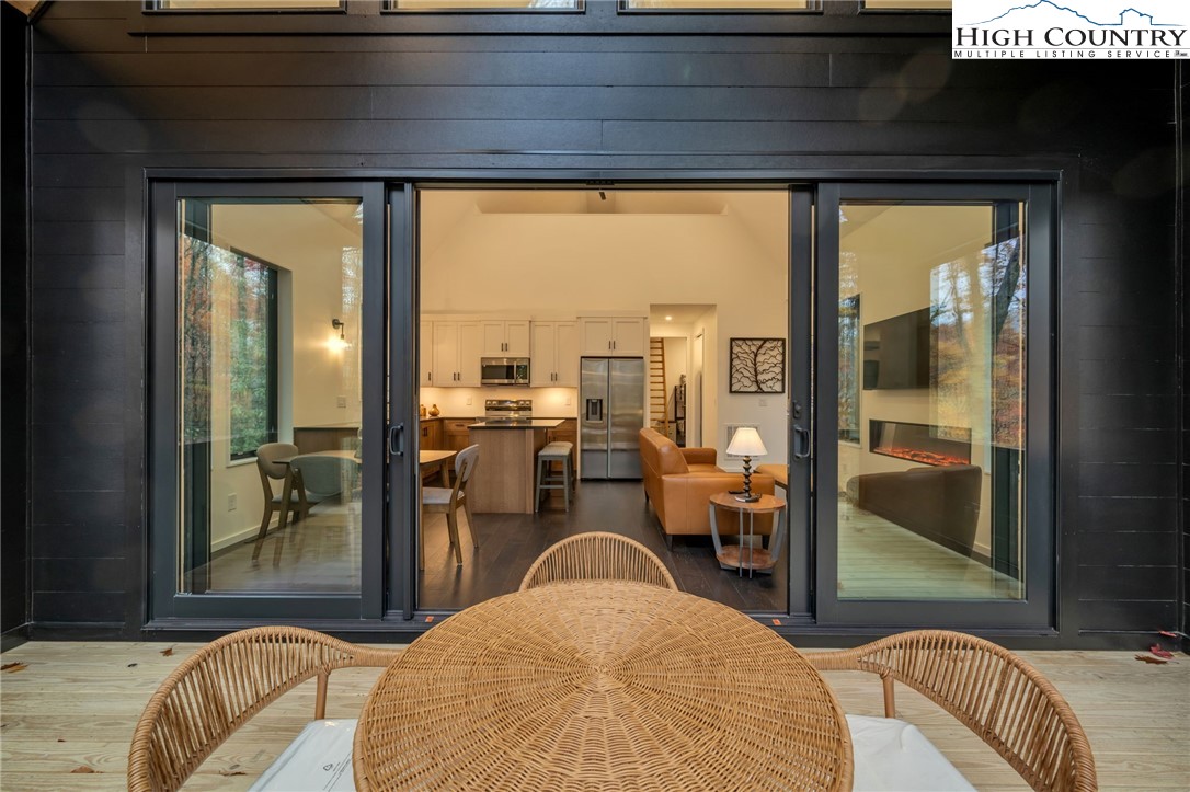 106 Jackpine Road Beech Mountain, NC 28604 - Photo 22 of 30 a living room with a couch and a table