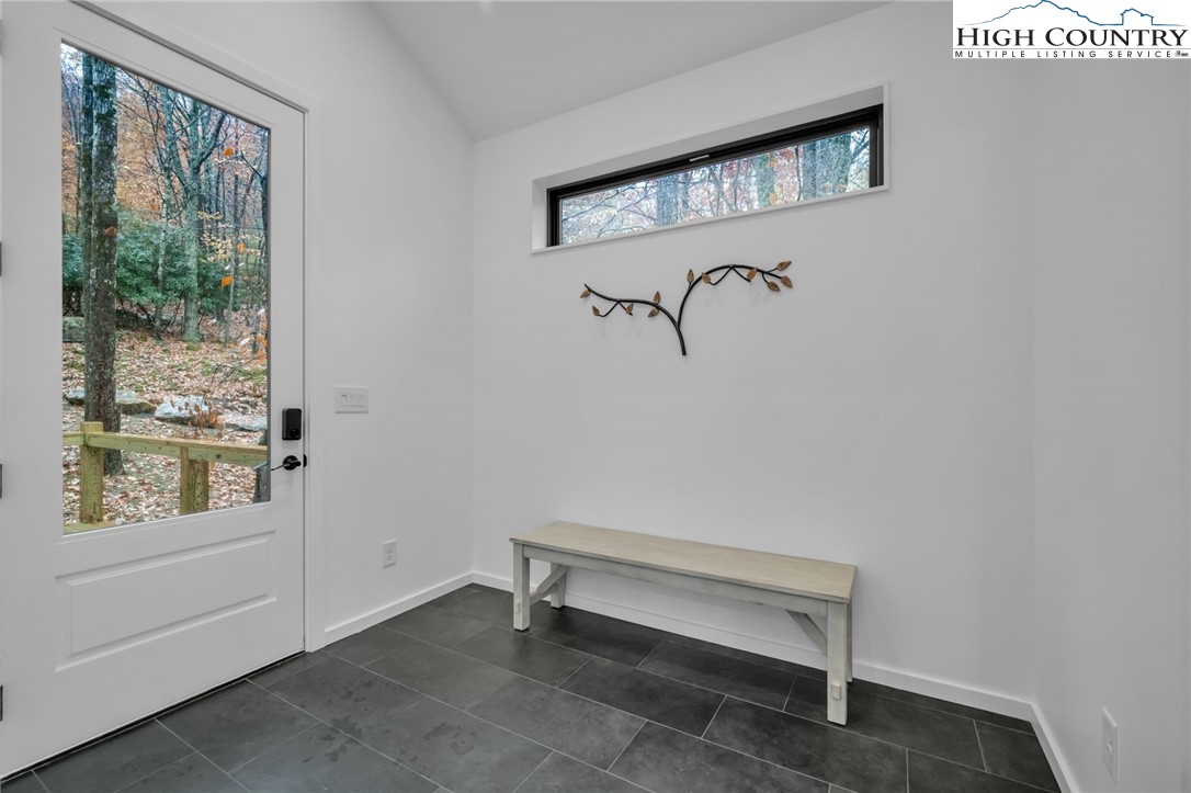 106 Jackpine Road Beech Mountain, NC 28604 - Photo 23 of 30 a view of room with window and lounge chair