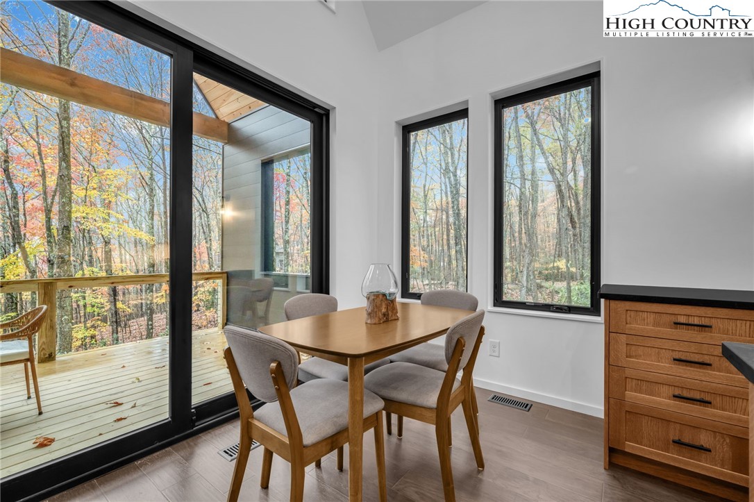 106 Jackpine Road Beech Mountain, NC 28604 - Photo 4 of 30 a dining room with furniture and window