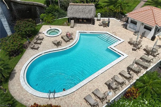 an aerial view of a house with a swimming pool