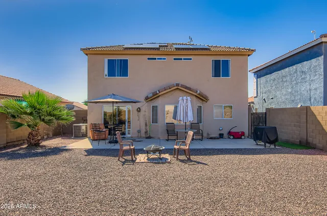 a front view of a house with sitting area