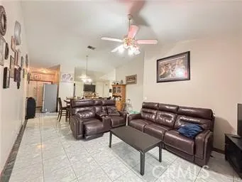 a kitchen with stainless steel appliances granite countertop a refrigerator stove microwave and sink