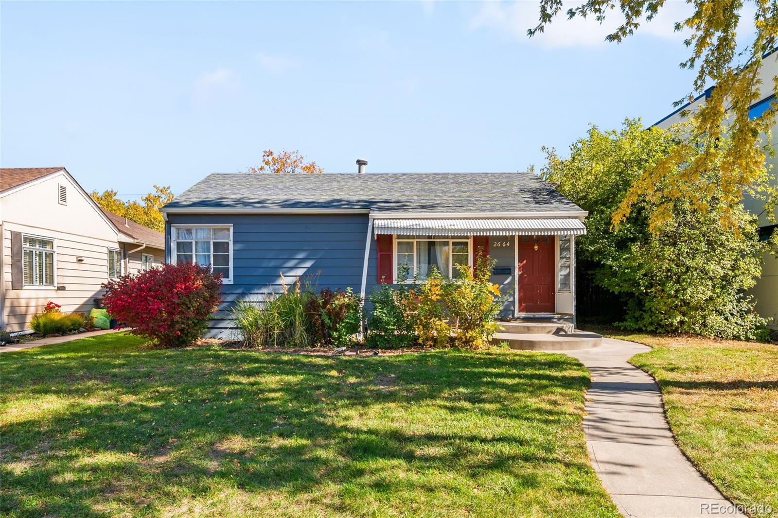 2664 South Cook Street Denver, CO 80210 - Photo 1 of 13 a front view of house with yard and green space
