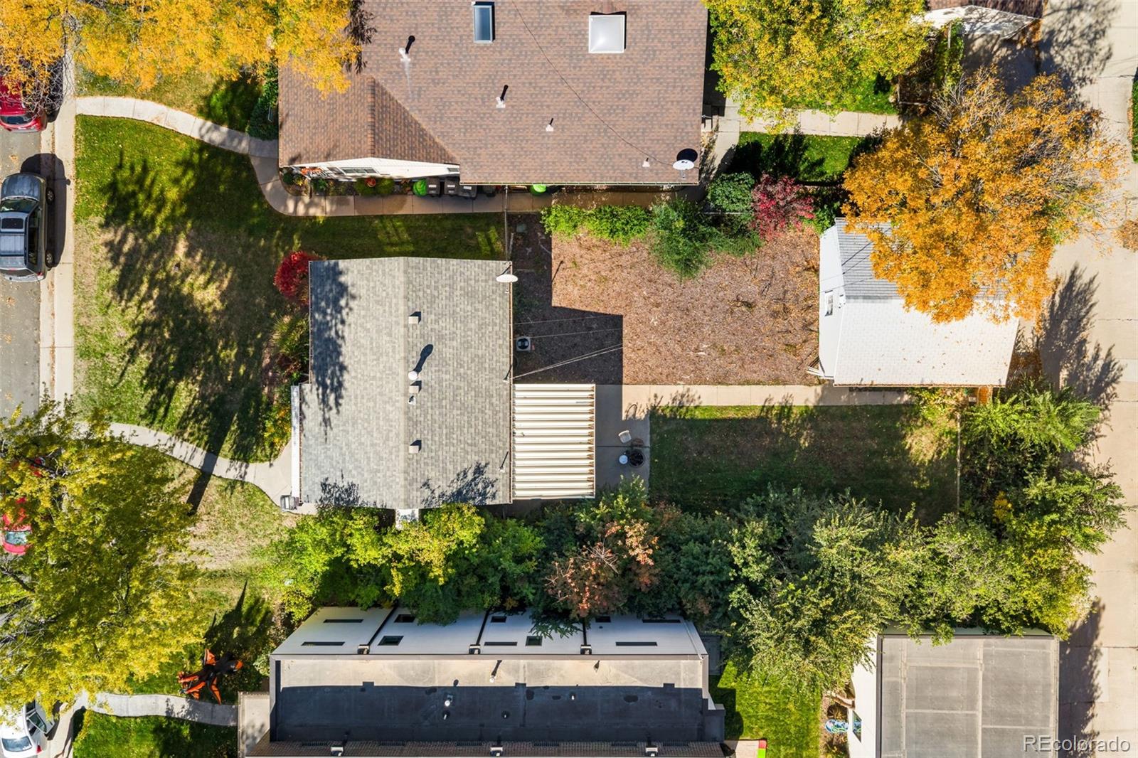 2664 South Cook Street Denver, CO 80210 - Photo 5 of 13 an aerial view of a house with a yard and garden