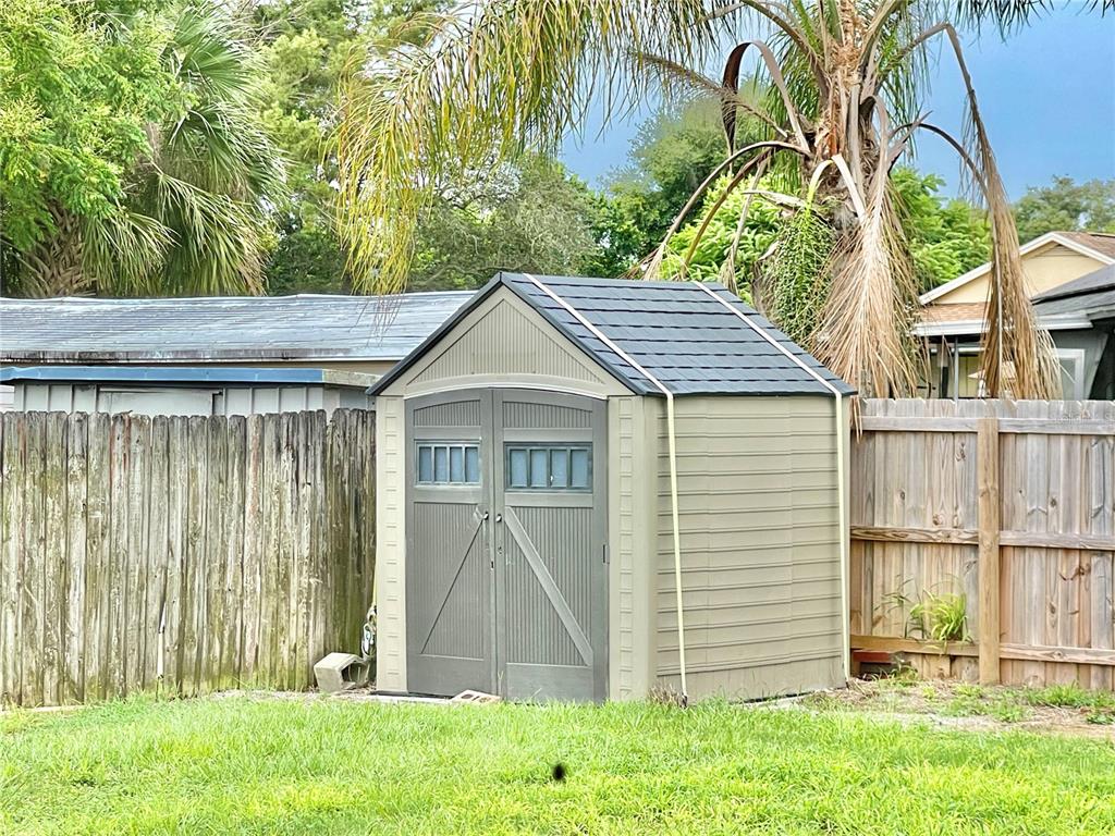 600 Ridgefield Avenue Ocoee, FL 34761 - Photo 12 of 45 Storage shed in back yard with privacy fencing