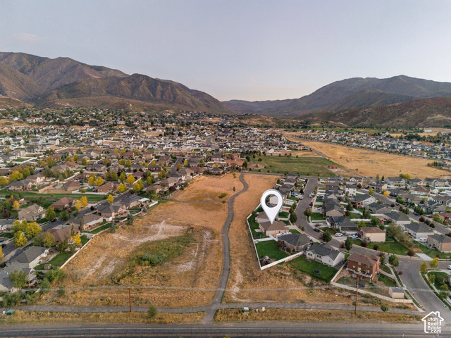 1288 North Horizon View Loop Elk Ridge, UT 84651 - Photo 36 of 38 Expansive mountain backdrop with a residential community, featuring a suburban street grid and scattered green spaces