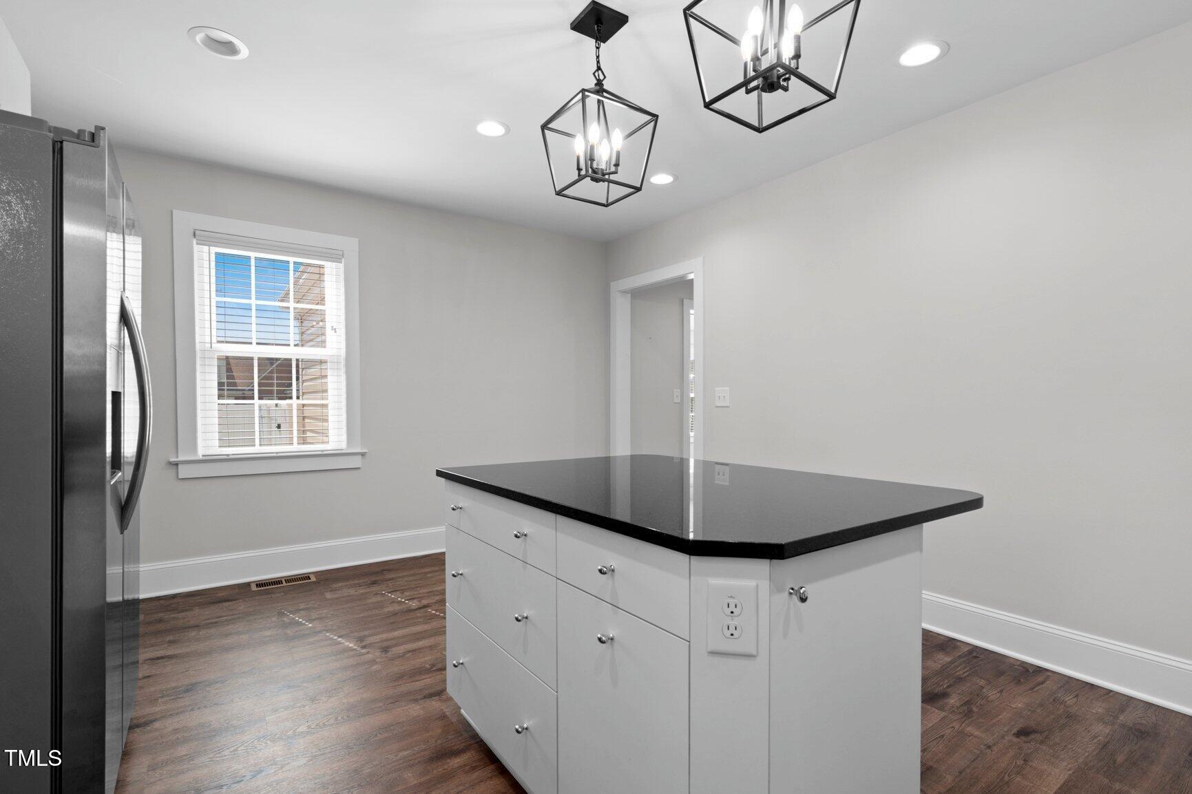 216 Whitfield Street Enfield, NC 27823 - Photo 14 of 31 a kitchen with stainless steel appliances granite countertop a sink and a window