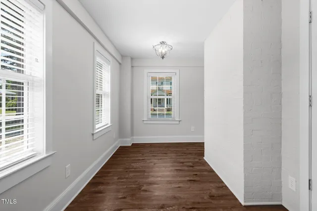 a kitchen with stainless steel appliances granite countertop a sink and a window