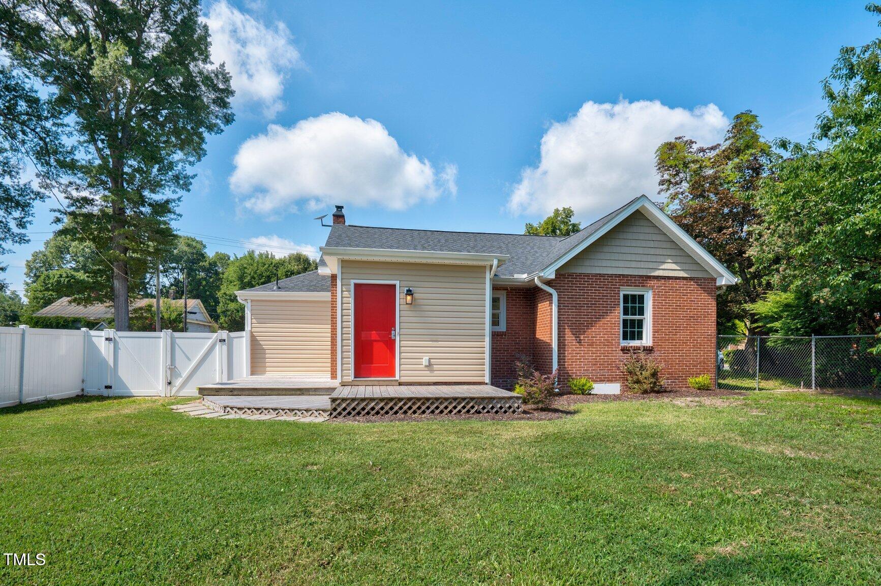 216 Whitfield Street Enfield, NC 27823 - Photo 26 of 31 a front view of house with yard and green space