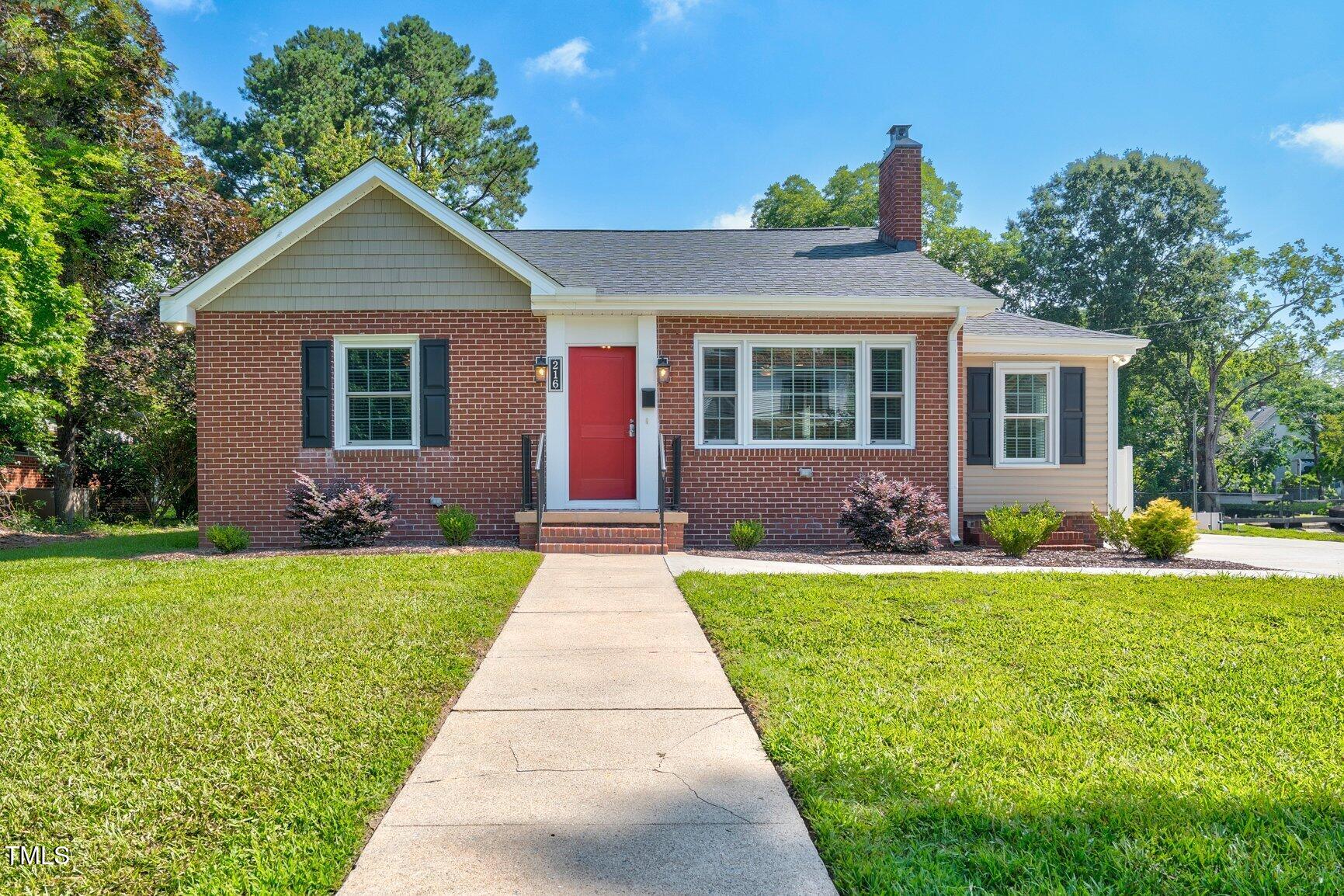 216 Whitfield Street Enfield, NC 27823 - Photo 2 of 31 a front view of house with yard and green space