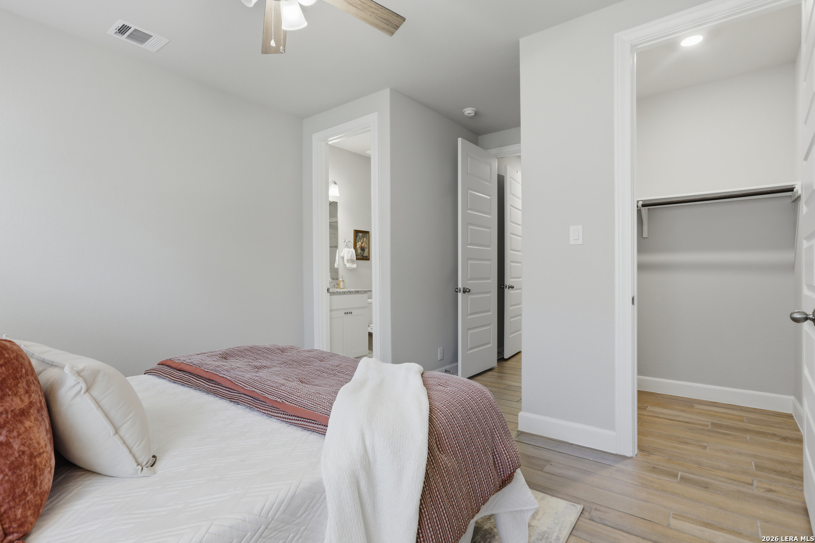 337 Misty Sails Cibolo, TX 78108 - Photo 27 of 50 a bedroom with a bed and a chandelier