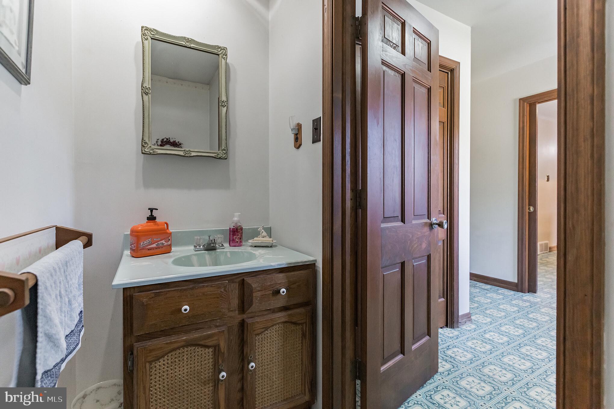 220 Robinson Road Salem, NJ 08079 - Photo 11 of 23 a utility room with a sink a vanity and mirror
