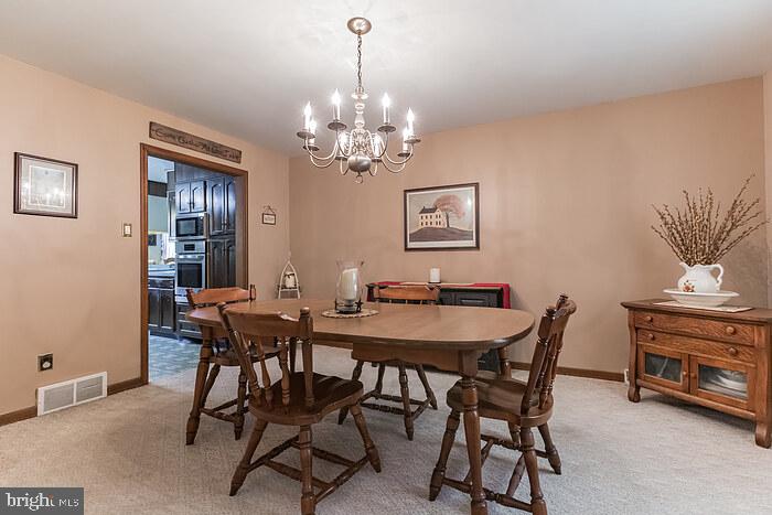 220 Robinson Road Salem, NJ 08079 - Photo 13 of 23 a view of a dining room with furniture and chandelier