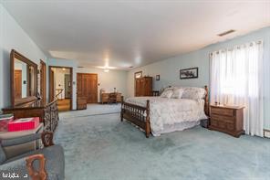 220 Robinson Road Salem, NJ 08079 - Photo 15 of 23 a spacious bedroom with a bed a couch and dresser
