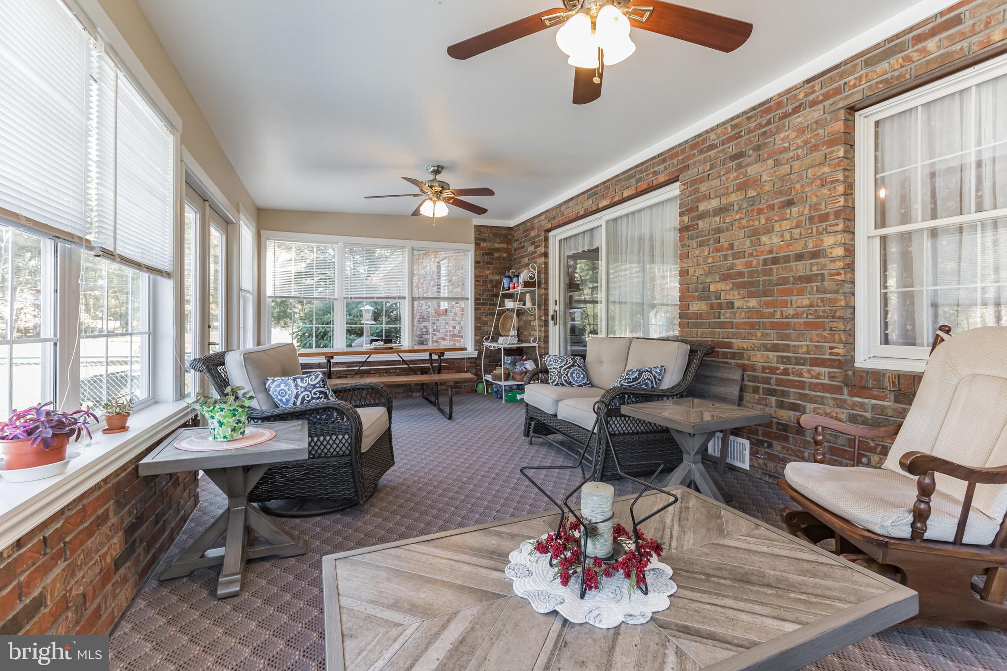 220 Robinson Road Salem, NJ 08079 - Photo 7 of 23 a living room with furniture and floor to ceiling windows