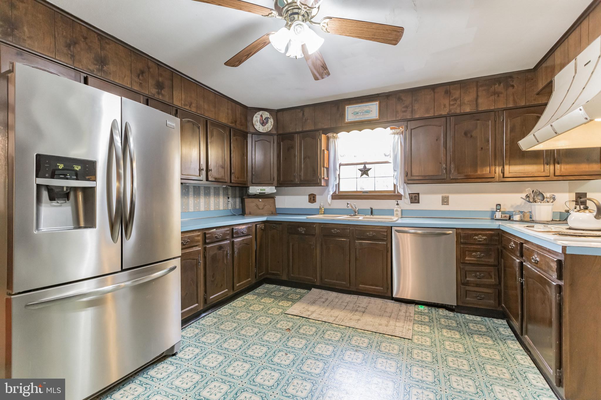220 Robinson Road Salem, NJ 08079 - Photo 10 of 23 a kitchen with stainless steel appliances granite countertop a refrigerator sink and cabinets