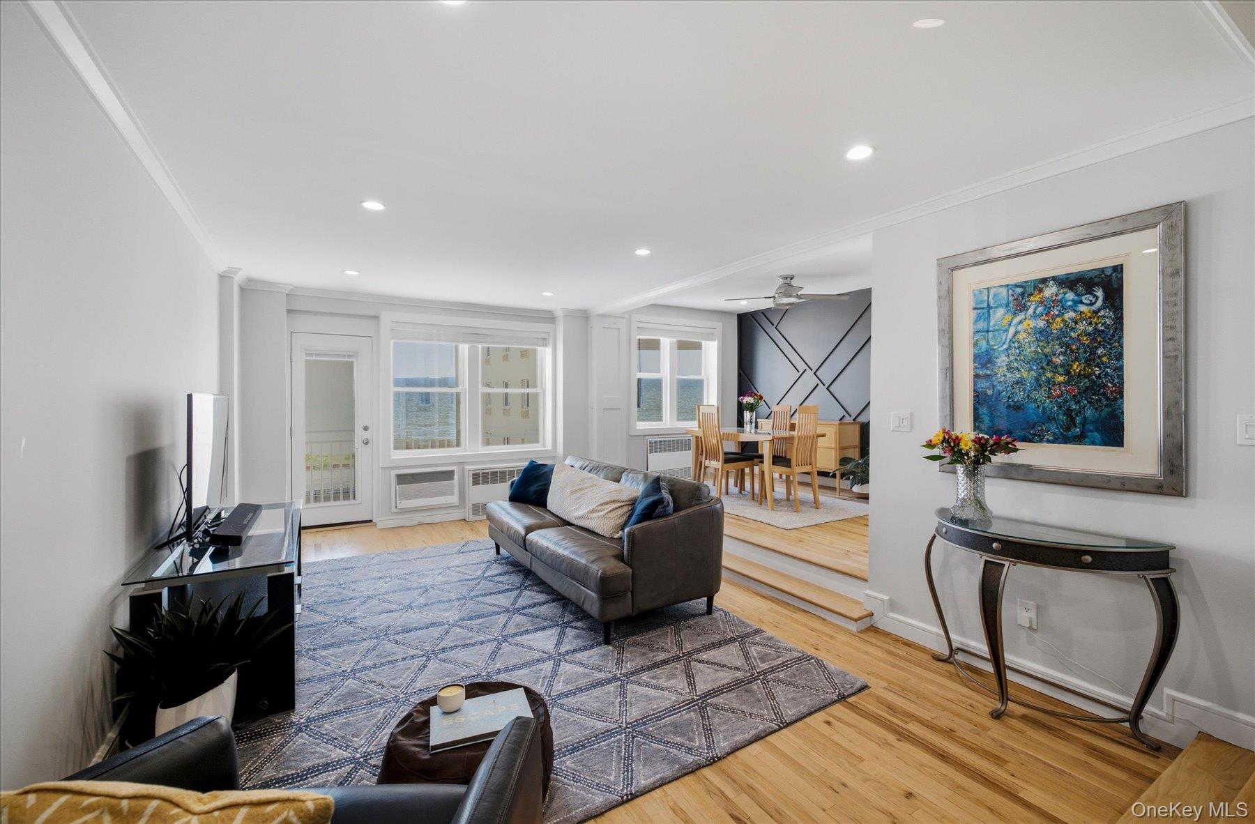 522 Shore Road, Unit 3BB Long Beach, NY 11561 - Photo 2 of 27 Living area with hardwood floors, recessed lighting, and ocean views