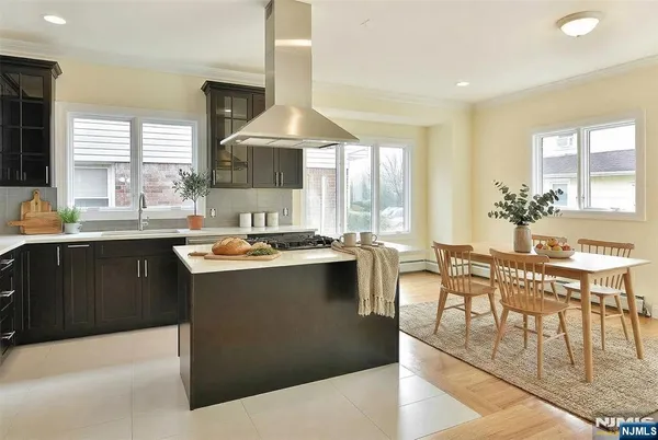 a kitchen with counter top space a sink appliances and cabinets