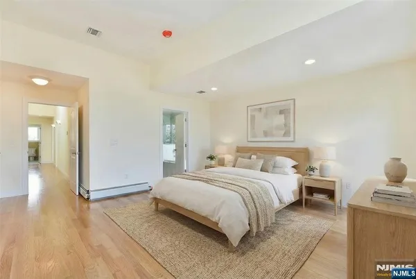 a bedroom with a bed and a table