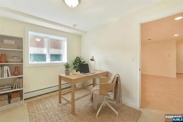 a dining room with furniture and window