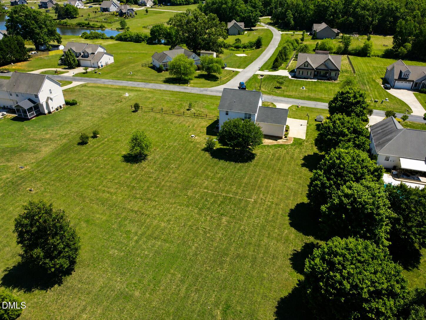 51 Water Front Lane Timberlake, NC 27583 - Photo 27 of 29 a view of a houses with a garden