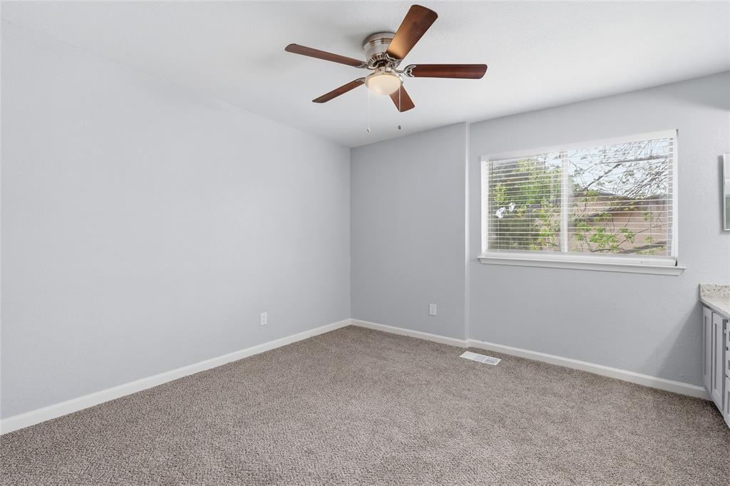 620 West Union Bower Road Irving, TX 75061 - Photo 13 of 22 Unfurnished bedroom featuring ceiling fan and light carpet