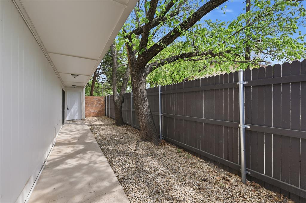 620 West Union Bower Road Irving, TX 75061 - Photo 20 of 22 Patio and courtyard with wood privacy fence.