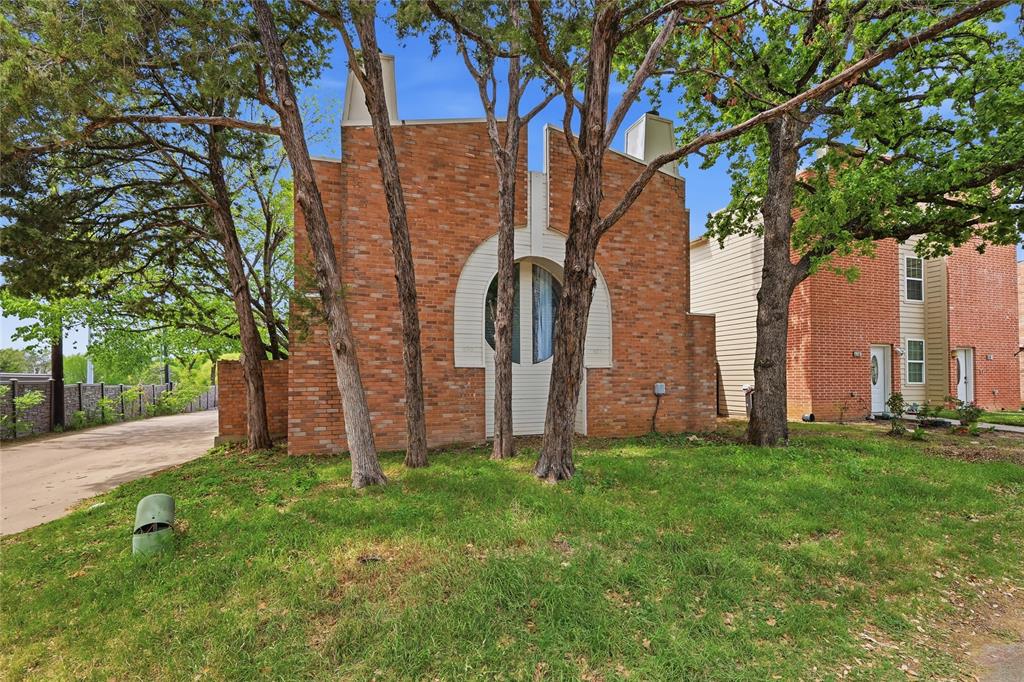 620 West Union Bower Road Irving, TX 75061 - Photo 22 of 22 View of front of home with a chimney, brick siding, and a front lawn