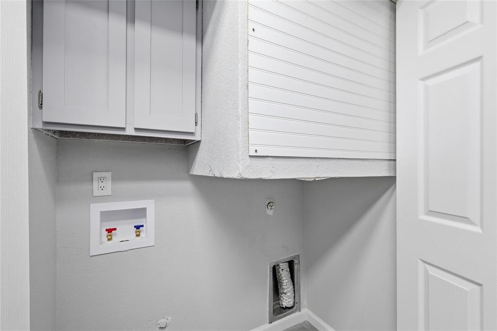 620 West Union Bower Road Irving, TX 75061 - Photo 7 of 22 Laundry room featuring cabinet space and washer hookup