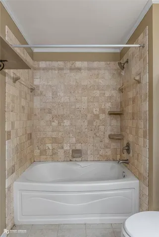 a bathroom with a shower and a toilet