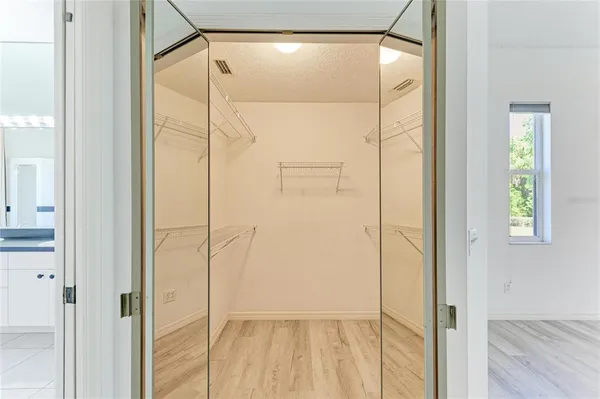 a bathroom with a glass shower door