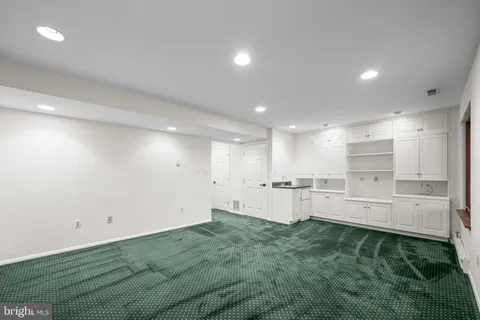 a large room with lots of wooden cabinets