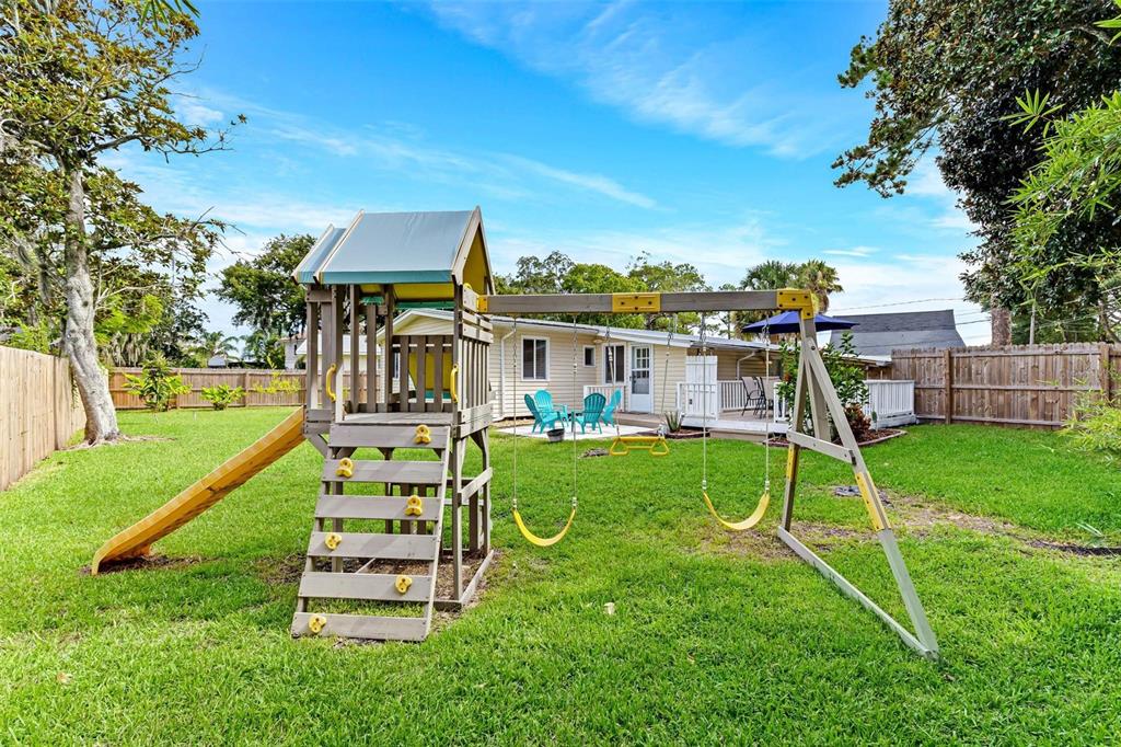 110 Terrapin Road St. Augustine, FL 32086 - Photo 14 of 33 a view of a house with a backyard and a slide