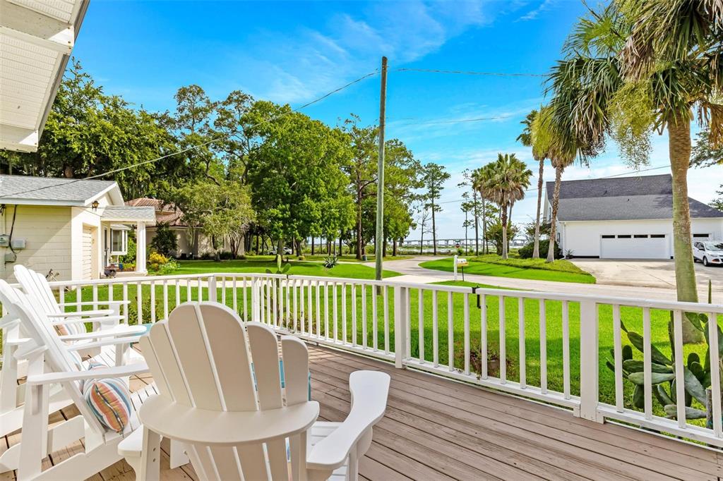110 Terrapin Road St. Augustine, FL 32086 - Photo 15 of 33 a view of a chair and tables in the deck