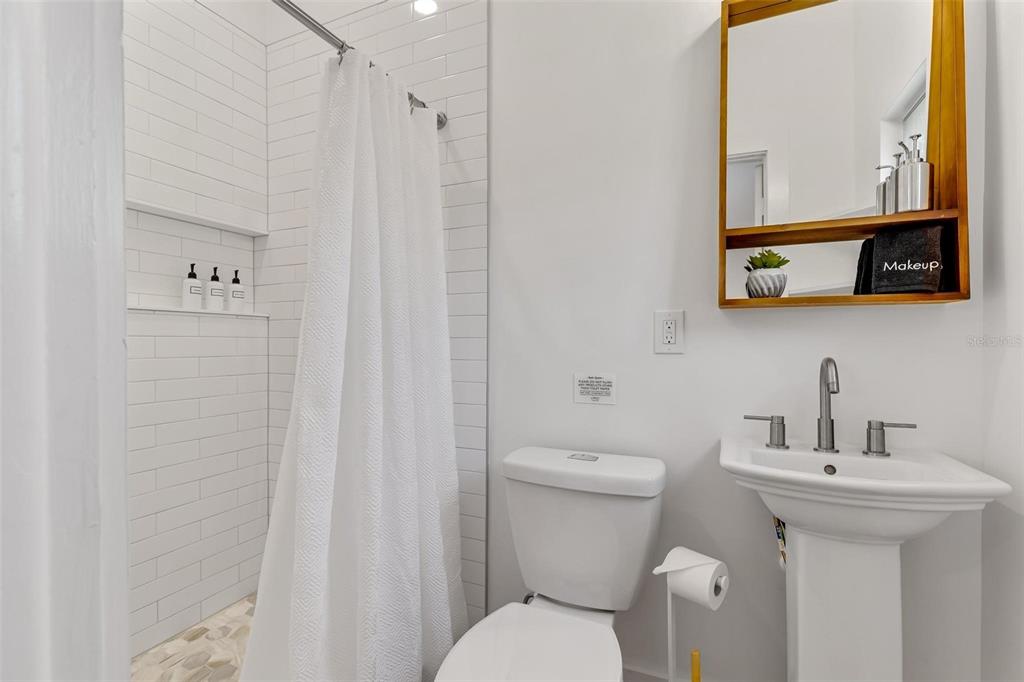 110 Terrapin Road St. Augustine, FL 32086 - Photo 24 of 33 a bathroom with a toilet sink and mirror