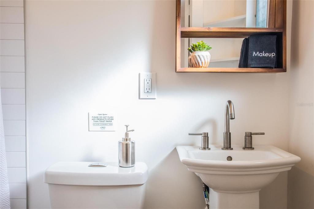 110 Terrapin Road St. Augustine, FL 32086 - Photo 25 of 33 a bathroom with a sink a mirror and a window
