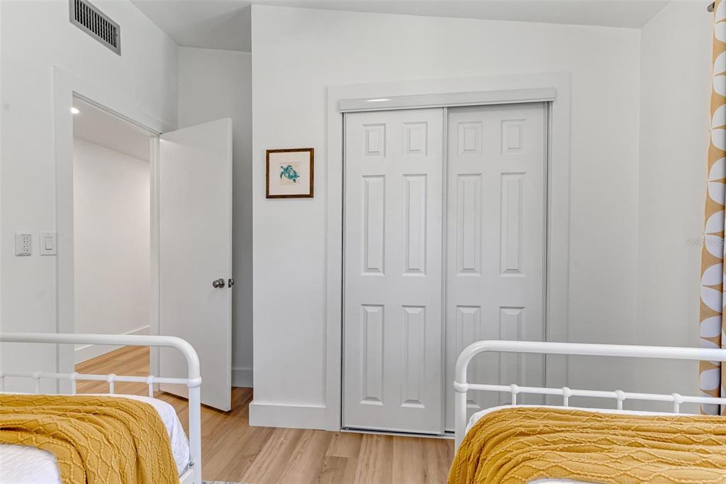 110 Terrapin Road St. Augustine, FL 32086 - Photo 29 of 33 a bedroom with a bed and a wooden floor