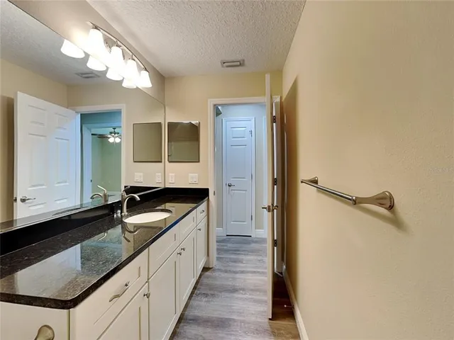 a kitchen with a sink and a refrigerator