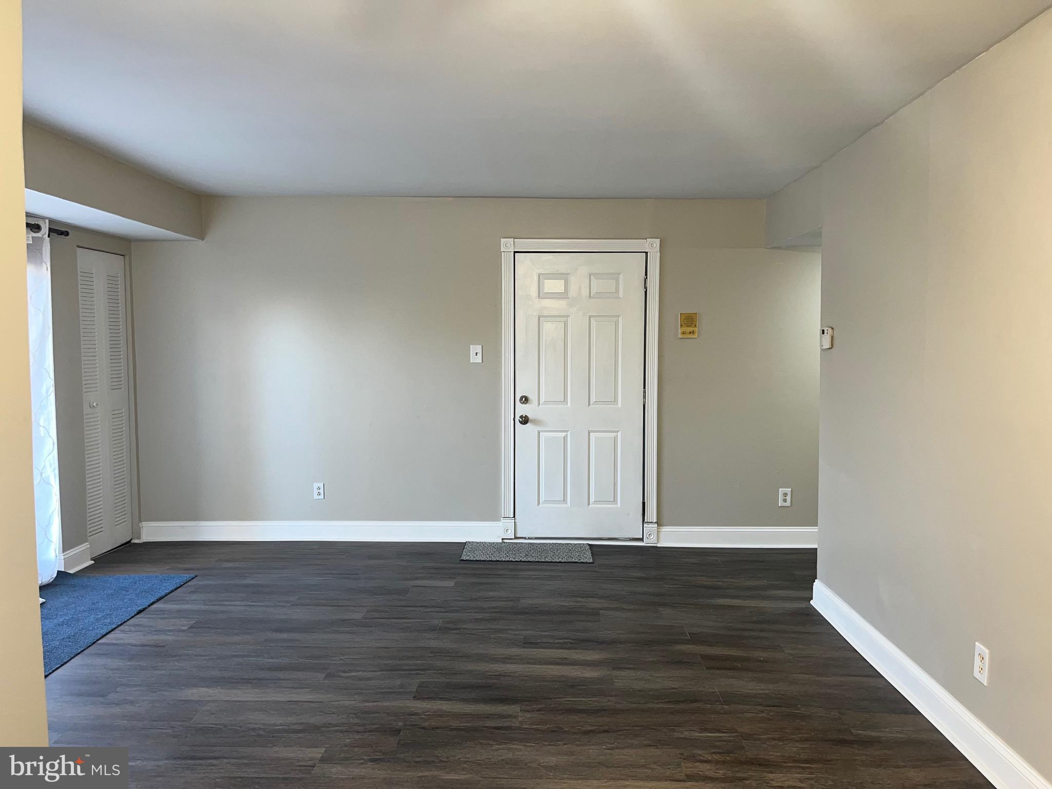 8030 Ditman Street, Unit 44H Philadelphia, PA 19136 - Photo 11 of 25 wooden floor in an empty room