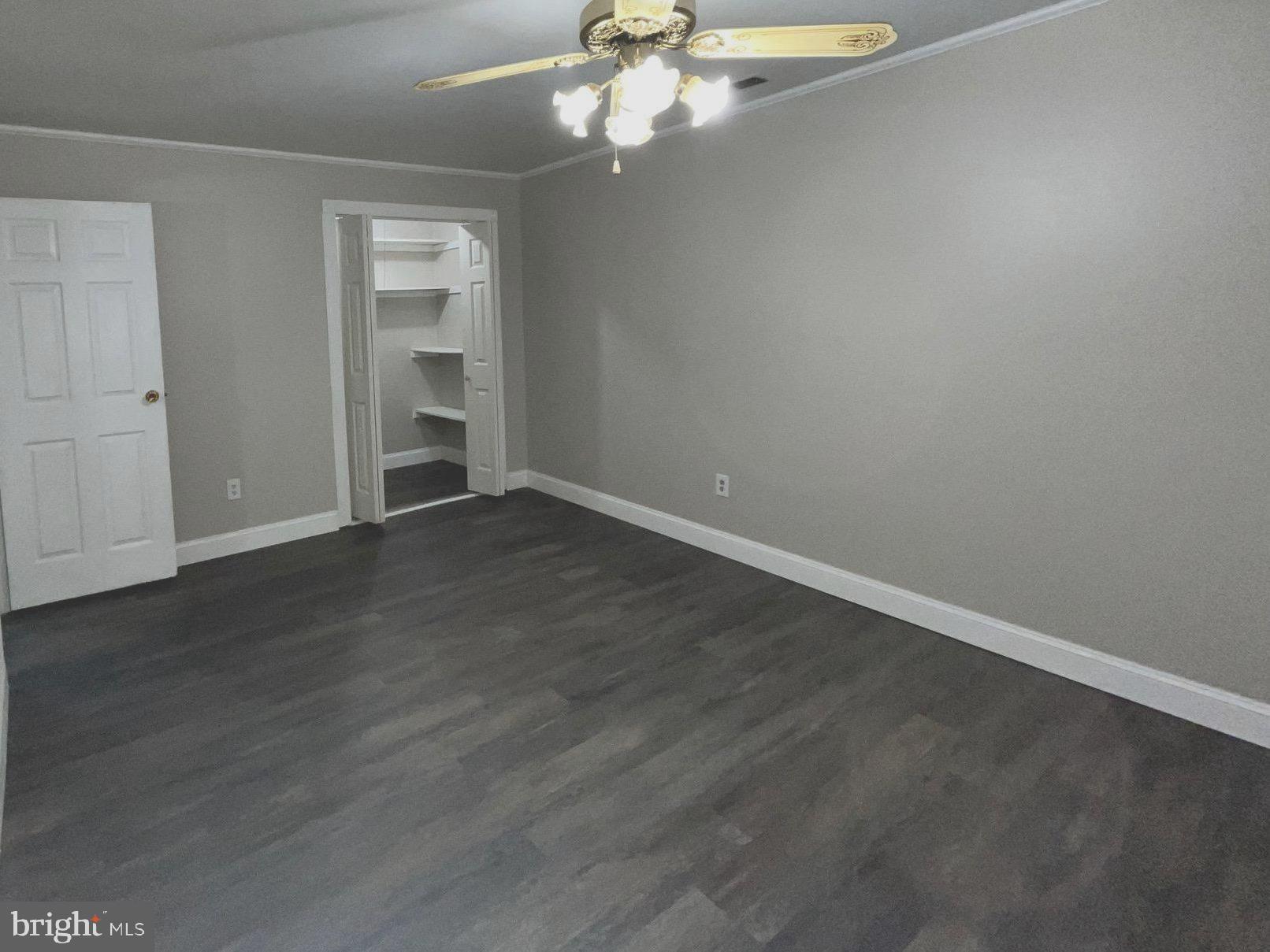 8030 Ditman Street, Unit 44H Philadelphia, PA 19136 - Photo 15 of 25 an empty room with wooden floor closet and windows