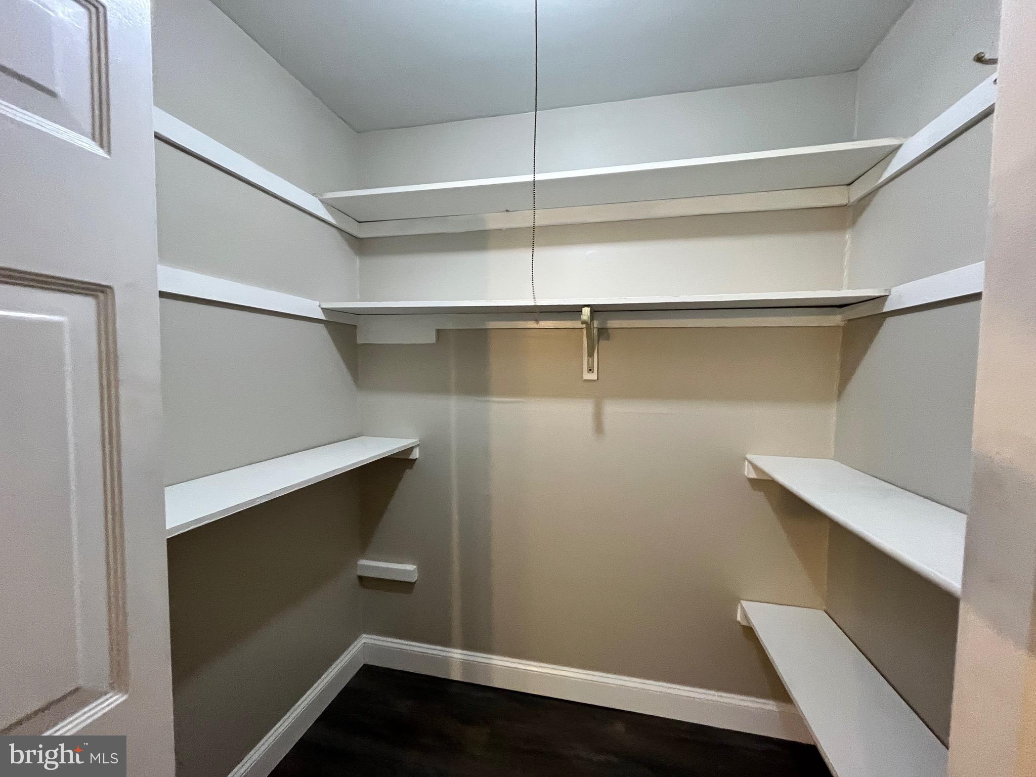 8030 Ditman Street, Unit 44H Philadelphia, PA 19136 - Photo 18 of 25 a view of walk in closet with empty racks