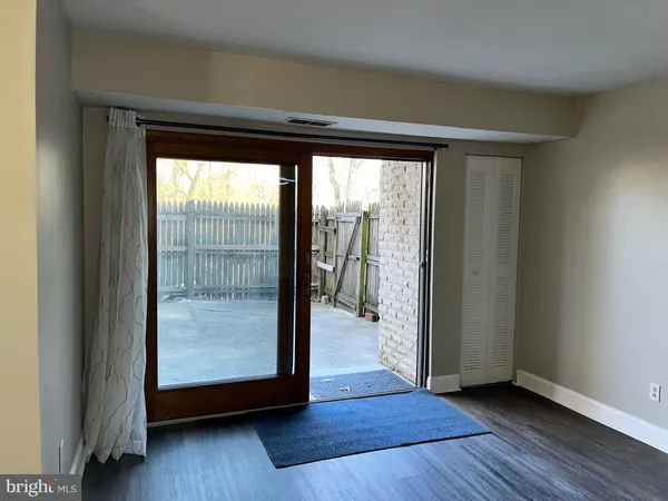 a view of an empty room and wooden floor