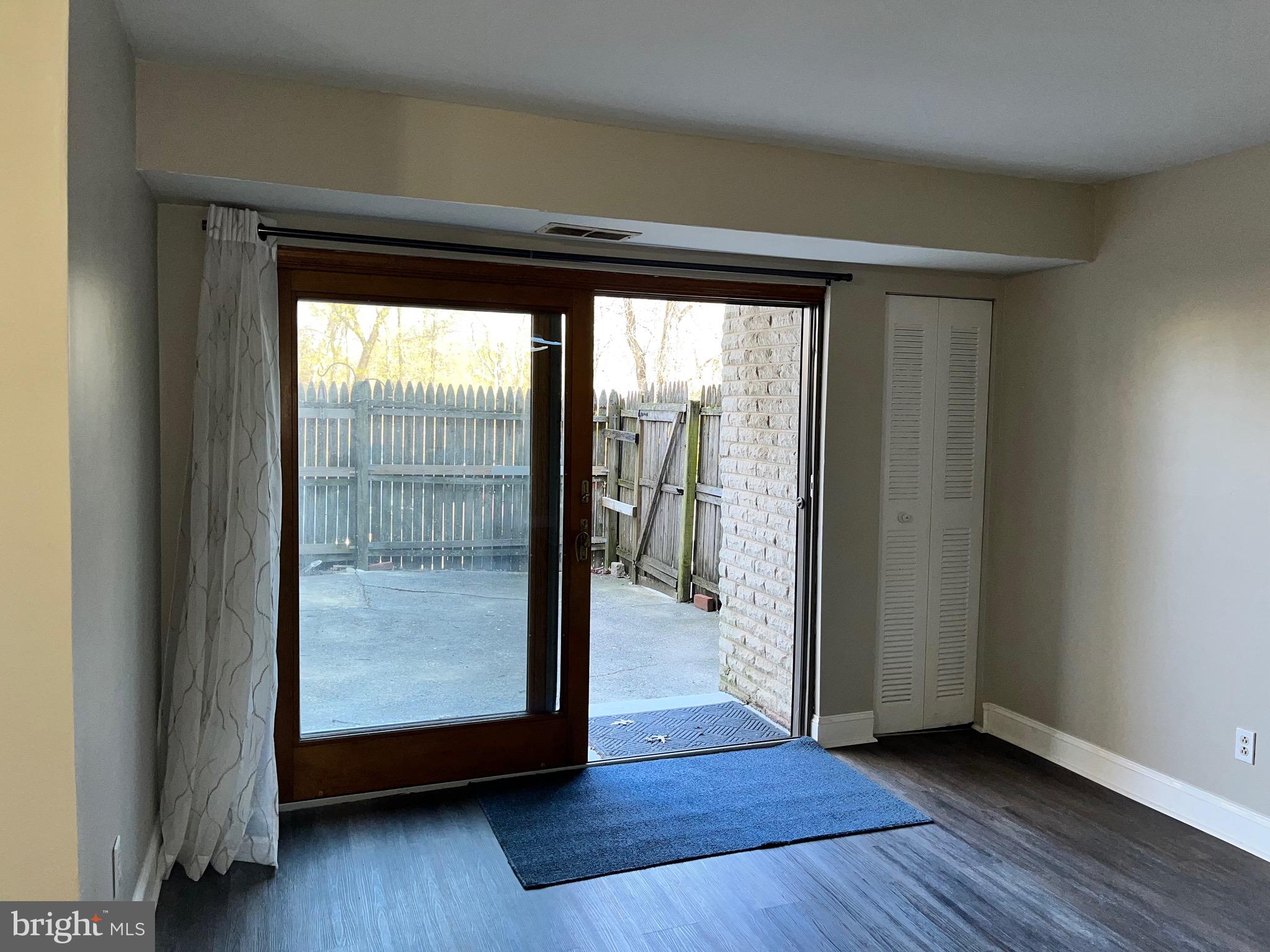 8030 Ditman Street, Unit 44H Philadelphia, PA 19136 - Photo 3 of 25 a view of an empty room and wooden floor