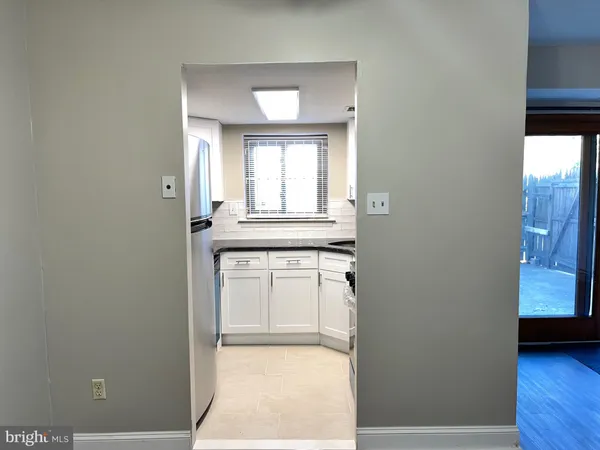 a view of a kitchen with a sink and a window