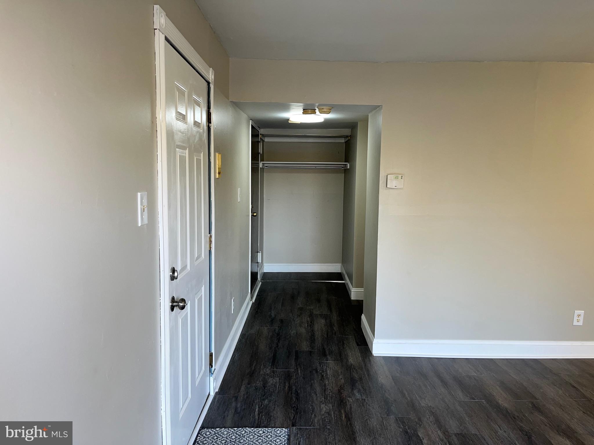 8030 Ditman Street, Unit 44H Philadelphia, PA 19136 - Photo 6 of 25 a view of a hallway with wooden floor